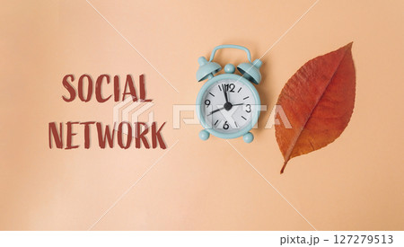 Clock with the hands on the numbers 12 and 8 is on a leaf Clock with the hands on the numbers 12 and 8 is on a leaf 127279513