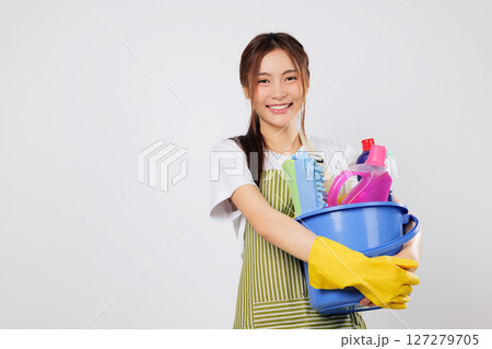 Cleaning tools and bucket of supplies in hand, woman ready to start cleaning with confidence and all the supplies at her fingertips. isolated studio white background Cleaning tools and bucket of supplies in hand, woman ready to start cleaning with confidence and all the supplies at her fingertips. isolated studio white background 127279705
