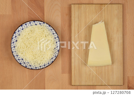 Finely grated cheese 127280708