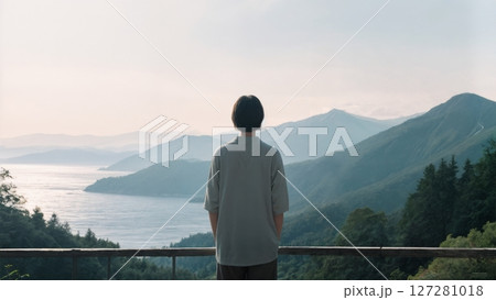 Serene Faith in Nature, Person Contemplating, Spiritual Connection, and Creation's Beauty. Perfect for nature-inspired faith content, retreats, and peaceful reflection. 127281018