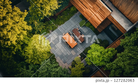 Elegant modern wooden house surrounded by lush greenery 127282063