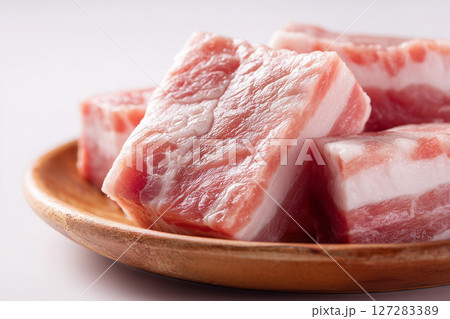 Raw pork belly on a wooden plate. Meat concept 127283389