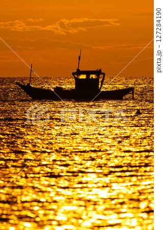 silhouette fishing boats on sunset silhouette fishing boats on sunset 127284190