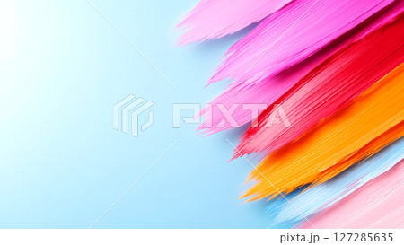 Colorful brushstrokes creating vibrant diagonal lines on light blue background 127285635