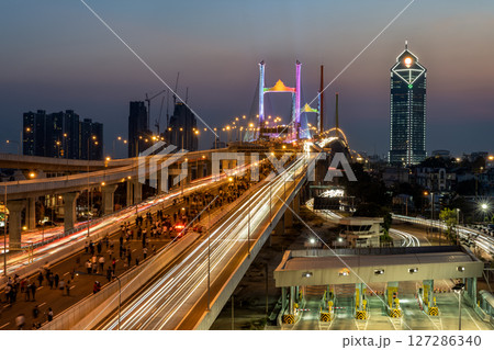 Thotsamarachan Bridge (Rama IX Bridge) crossing Chao phraya river. Beautiful city of Bangkok during sunset time. Thotsamarachan Bridge (Rama IX Bridge) crossing Chao phraya river. Beautiful city of Bangkok during sunset time. 127286340