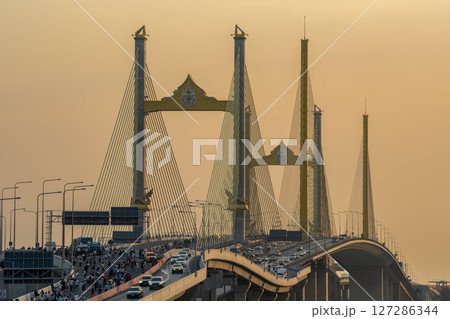 Bangkok, Thailand - January 17, 2025 : Thotsamarachan Bridge (Rama IX Bridge) crossing Chao phraya river. Beautiful city of Bangkok during sunset time. Bangkok, Thailand - January 17, 2025 : Thotsamarachan Bridge (Rama IX Bridge) crossing Chao phraya river. Beautiful city of Bangkok during sunset time. 127286344