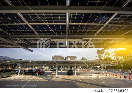Solar Panel Photovoltaic installation on a Roof of car parking lot, alternative electricity source - Sustainable Resources Concept. 127286366