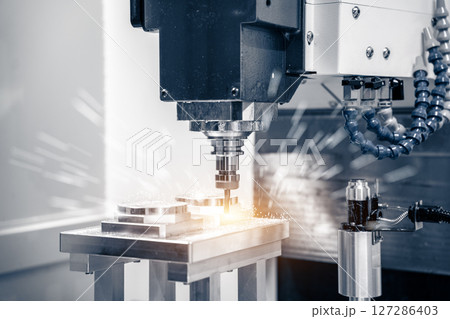 Working closeup CNC turning cutting metal Industry machine iron tools with splash water. Vertical mill metalworking process. 127286403