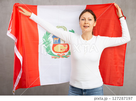 Positive girl with Peru flag rooting for your favorite team 127287197