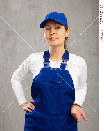 Smiling adult woman posing in uniform 127287199