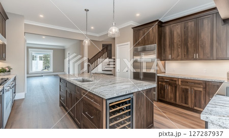 Modern Kitchen Island with Wine Cooler and Stainless Steel Appliances 127287937