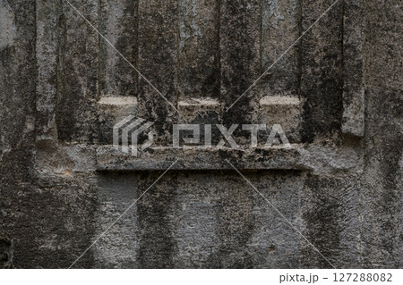 The design of an old, shabby, dirty column. The column in close-up 127288082