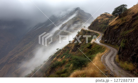 Winding Mountain Road Through Foggy Landscape 127288737