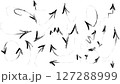Vector illustration of a set of hand-drawn black arrows on a white background. This collection includes various arrow styles such as curved, straight, zigzag, looped, and spiral arrows in a doodle 127288999