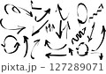 Vector illustration of a set of hand-drawn black arrows on a white background. This collection includes various arrow styles such as curved, straight, zigzag, looped, and spiral arrows in a doodle 127289071