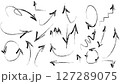 Vector illustration of a set of hand-drawn black arrows on a white background. This collection includes various arrow styles such as curved, straight, zigzag, looped, and spiral arrows in a doodle 127289075