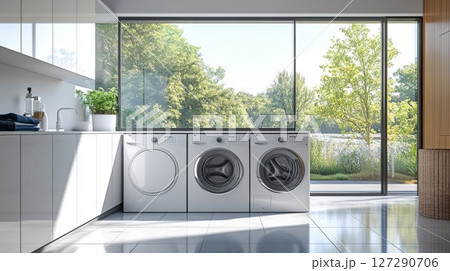 Modern Laundry Room with Three Appliances and a Large Window 127290706