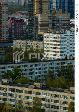 urban landscape with tall buildings and several trees, residential area, multi-storey buildings. urban landscape with tall buildings and several trees, residential area, multi-storey buildings. 127291009