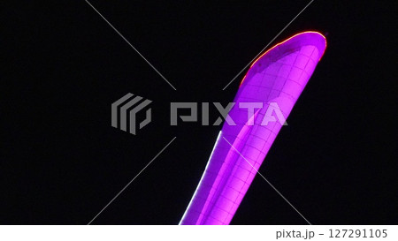 Purple Flag Night Illumination: Outdoor nighttime display vibrant purple flag, likely celebratory event. 127291105