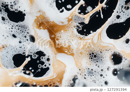 Water splashing on black background creating dynamic abstract pattern 127291394