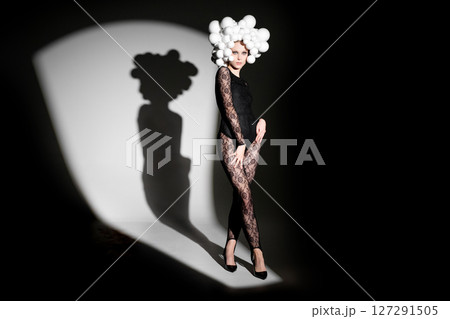 Fashion Model with Unique Headpiece and Shadow Fashion Model with Unique Headpiece and Shadow 127291505