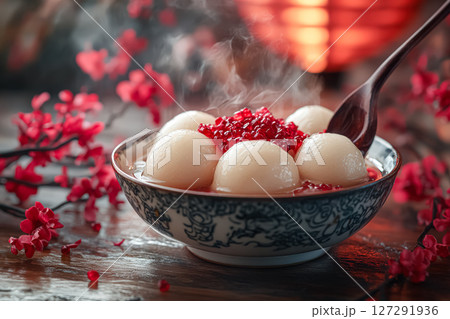 Bowl of fruit with a spoon in it 127291936