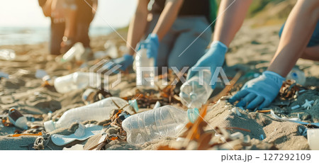 Group of people are cleaning up a beach 127292109