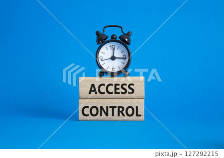Access Control symbol. Concept words Access Control on wooden blocks. Beautiful blue background with alarm clock. Business and Access Control concept. Copy space. Access Control symbol. Concept words Access Control on wooden blocks. Beautiful blue background with alarm clock. Business and Access Control concept. Copy space. 127292215