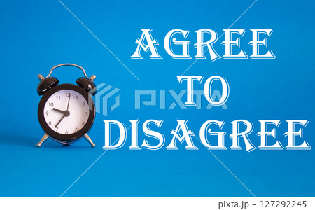 Agree to Disagree symbol. Beautiful blue background with alarm clock. Business and Agree to Disagree concept. Copy space. Agree to Disagree symbol. Beautiful blue background with alarm clock. Business and Agree to Disagree concept. Copy space. 127292245