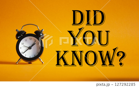 Did you know symbol. Beautiful orange background with alarm clock. Business and Did you know concept. Copy space. 127292285