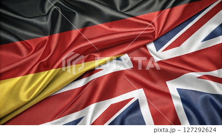German and British Flags Intertwined Representing Unity and Collaboration 127292624