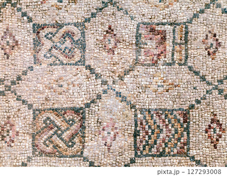 Explore the beauty of ancient mosaic patterns characterized by intricate geometric designs 127293008