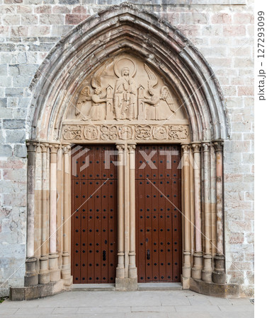 Discovering the carved entrance of a historic church in Roncesvalles along the Camino de Santiago Discovering the carved entrance of a historic church in Roncesvalles along the Camino de Santiago 127293099