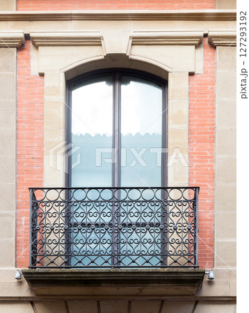 Decorative balcony with intricate metalwork in a historic building Decorative balcony with intricate metalwork in a historic building 127293192