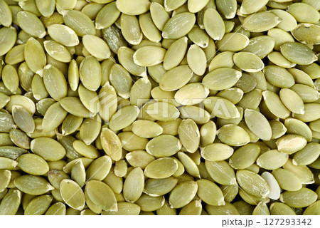 Full frame of peeled pumpkin seeds as background or texture. Full frame of peeled pumpkin seeds as background or texture. 127293342