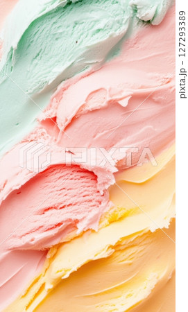 Close-up top view of colorful ice cream in waffle cones on a bright background, photographed with high clarity and detail for marketing and commercial projects. 127293389