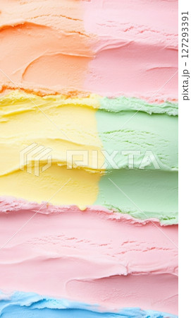 Top view of colorful ice cream in waffle cones with a vibrant background, captured in close-up, high-resolution photography for commercial and promotional use. 127293391