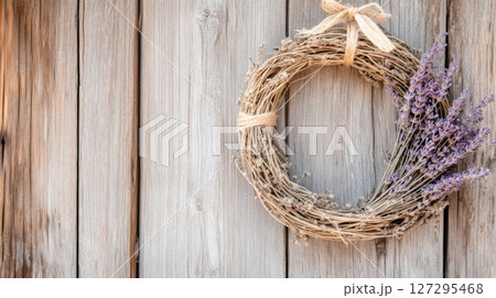 Cottagecore rustic wreath on weathered barn creating charming farmhouse atmosphere 127295468