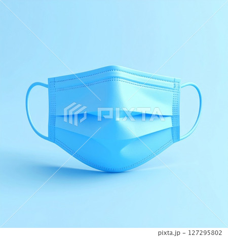 Light Blue Surgical Face Mask on Light Blue Background 127295802