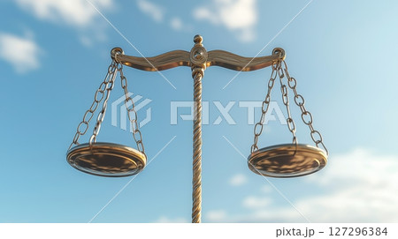 Symbol of justice with balanced scales against a blue sky. Symbol of justice with balanced scales against a blue sky. 127296384