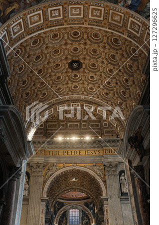 Ornate vaulted ceilings and central dome of Saint Peters Basilica in Vatican City richly decorated with golden details frescoes and religious architecture. High quality photo Ornate vaulted ceilings and central dome of Saint Peters Basilica in Vatican City richly decorated with golden details frescoes and religious architecture. High quality photo 127296625
