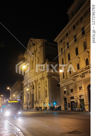 Night scene at Piazza Navona Rome with colorful balloons illuminated street lights and people in festive lively evening atmosphere Italy. High quality photo 127296769