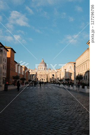 Morning view of Saint Peters Basilica Vatican City with symmetrical Renaissance architecture tourist walking in front historical religious landmark. High quality photo 127296786