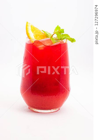 vibrant red berry cocktail with orange slice and fresh mint leaves served in clear glass with ice on white background. High quality photo vibrant red berry cocktail with orange slice and fresh mint leaves served in clear glass with ice on white background. High quality photo 127296974