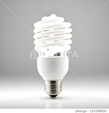 Modern energy-efficient light bulb on a plain background showcasing its spiral design and sleek appearance in bright lighting Modern energy-efficient light bulb on a plain background showcasing its spiral design and sleek appearance in bright lighting 127298626