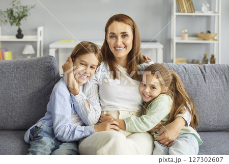 Happy Mother Sitting With Kids At Home For A Family Portrait Happy Mother Sitting With Kids At Home For A Family Portrait 127302607