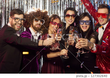 Happy Friends Celebrating With Champagne At Party 127302640