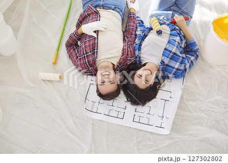Happy Family Couple Lying Together During Home Renovation 127302802