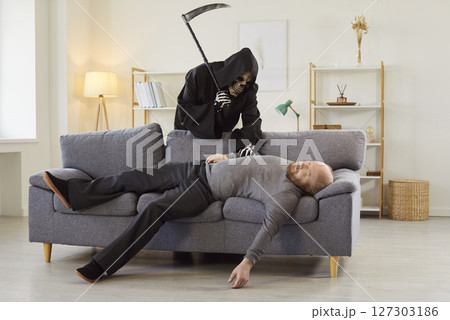 Senior man dying, Grim Reaper of Death with scythe finding new victim patient couch dying Senior man dying, Grim Reaper of Death with scythe finding new victim patient couch dying 127303186