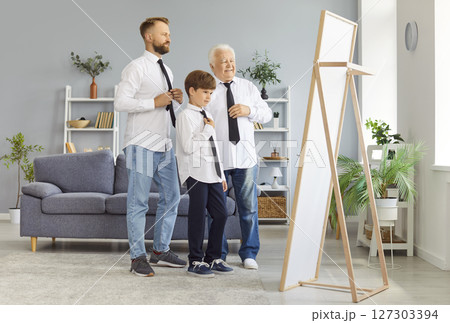 Grandfather, Father, And Son Looking In The Mirror While Dressing Shirts At Home 127303394